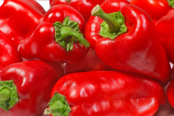 Red fresh tasty bell peppers closeup