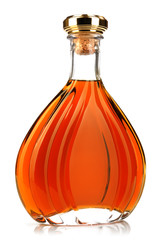 Alcohol cognac in a closed bottle on white background