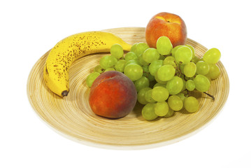 fruits on plate, isolated on white