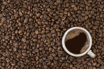 Coffee cup on a coffee beans background
