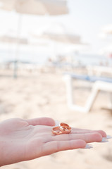 wedding rings in the hands of women
