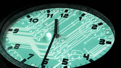 clock in time-lapse sequence and circuit boar as the background - Powered by Adobe