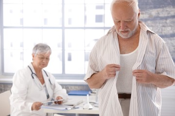 Fototapeta premium Male patient undressing at doctor's room