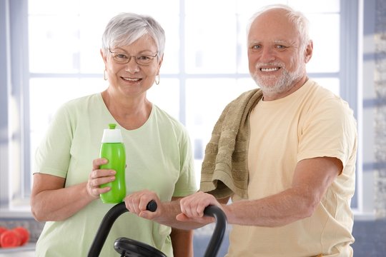 Portrait of happy senior couple in the gym