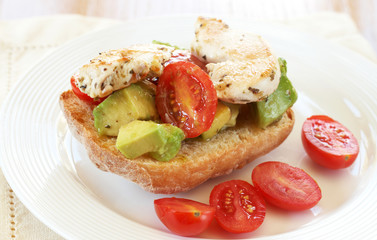 Tasty avocado, tomato and chicken bruschetta