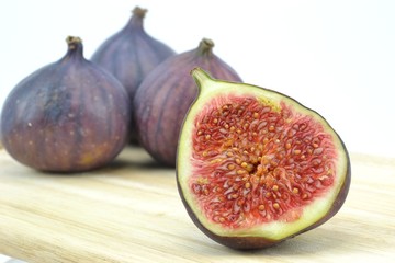 Figs fruit with selective focus on a wooden board