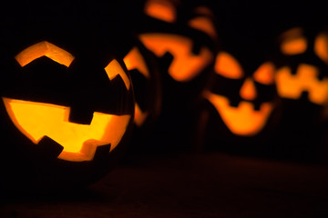 Carved Jack-o-lanterns lit for Halloween