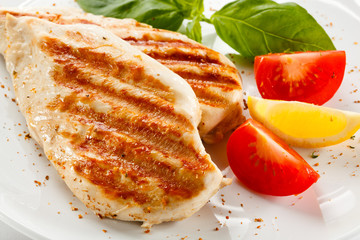 Grilled chicken breasts and vegetables