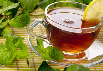 Cup of tea with lemon and mint