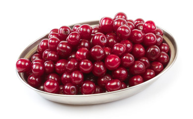 Bowl with ripe cherries. Isolated on a white background.
