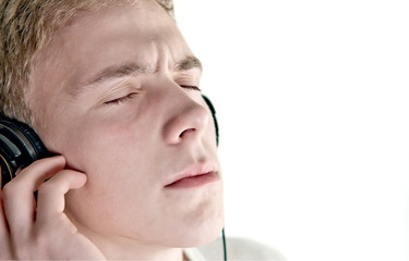 Guy enjoys listening to music