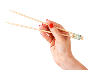 woman's hand and wooden chopsticks isolated on white