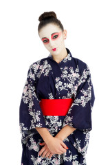 Pretty young geisha girl isolated