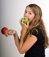 Young natural beauty eating a green and a red apple