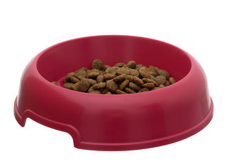 Bowl of dry dog food, kibble, isolated over white background