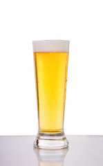Glass of beer against white background