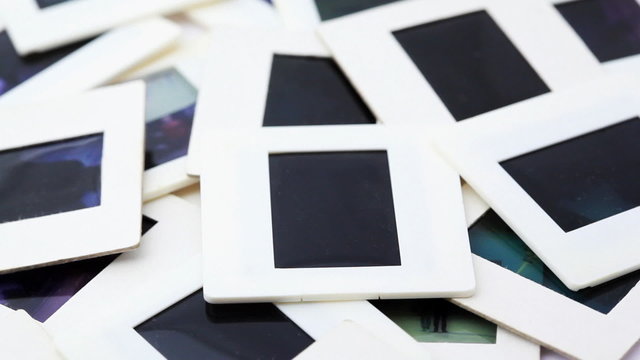 Bunch of slides in white framed rotates counterclockwise