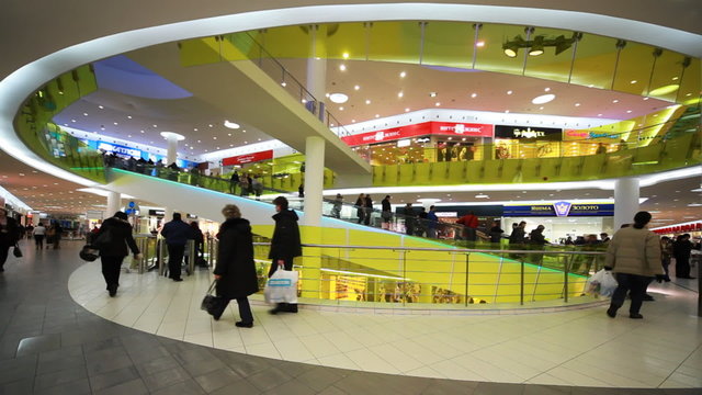 People move to escalator in new shopping center