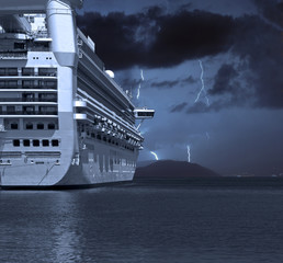 Cruise ship with lightning strikes in distance