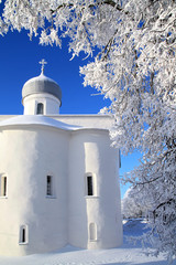 Fototapeta na wymiar orthodox christian church amongst white branches