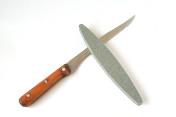 knife and emery on white background