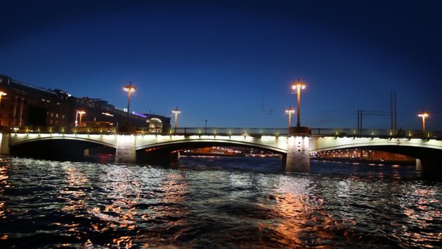 Cars traveling on bridge at night