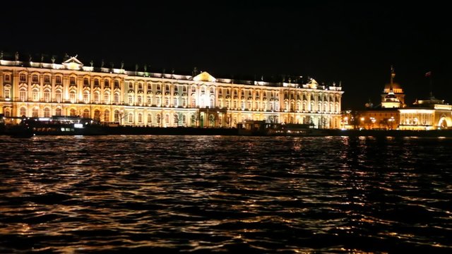 Winter Palace standing on embankment Neva River at night