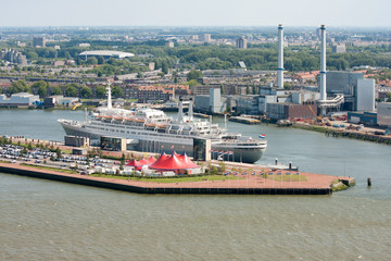 Aerial view of Dutch harbor Rotterdam with a big passenger ship