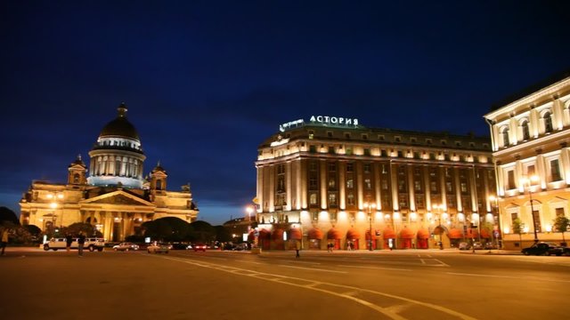 tourists are on Saint Isaac Square and Monument to Nicholas I