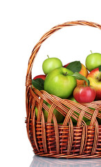 Basket of fresh ripe apples isolated on white
