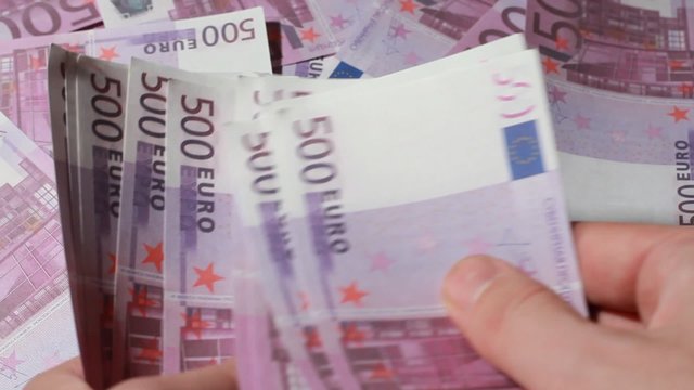 Hands recount souvenir banknote five hundred euros