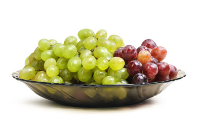 Grapes in a glass dish on white background