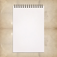 White notebook for painting on vintage background