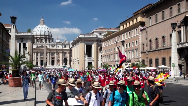 People are on international pilgrimage on street of Rome