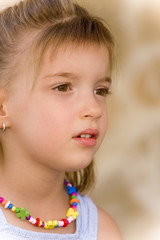 Close-up portrait of a pretty little girl