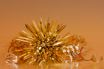 Gold sparkly holiday background with reflections.