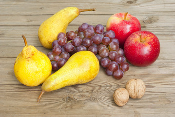 apples grapes and pears, wooden table