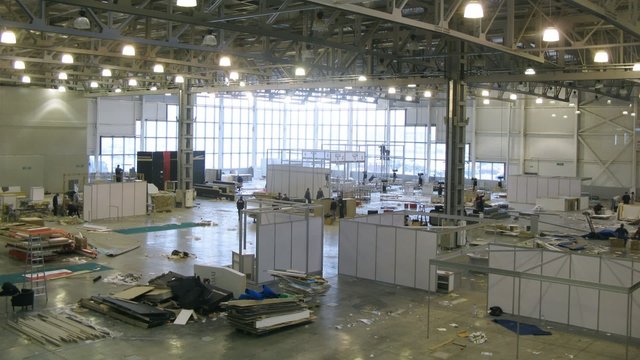 Workers prepare stands for exhibition