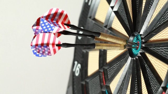 Three metallic darts hit special playboard