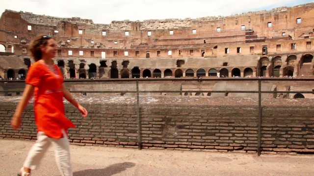 Woman walk along border of one of Colosseum levels