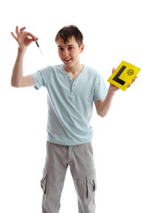 Teenager holding car keys and L plates