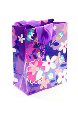 gift bag with floral print over white background
