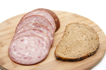 Presskopf mit Brot auf Holzteller