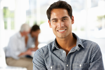 Hispanic businessman in office