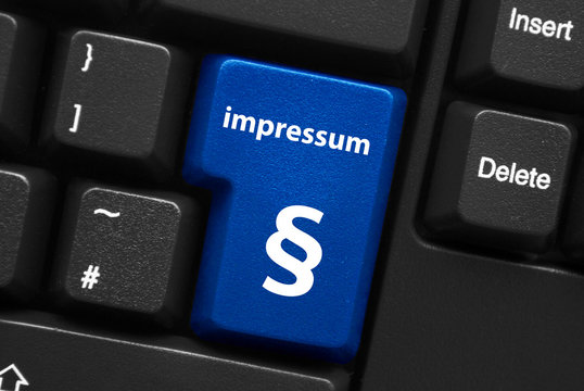 “impressum” key on keyboard (quality contact marketing button)