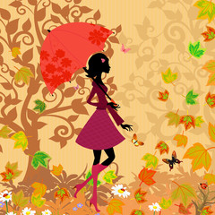 woman under an umbrella in the autumn