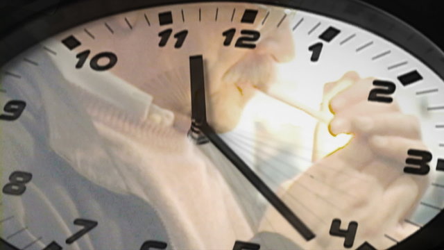 smoker reflected in clock