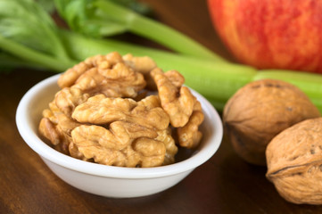 Raw walnut halves with celery and apple