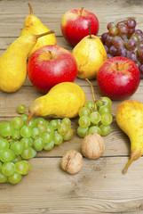 apples grapes and pears, wooden table