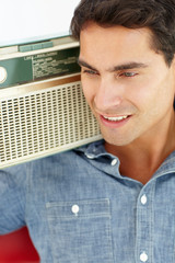 Young man listening to radio